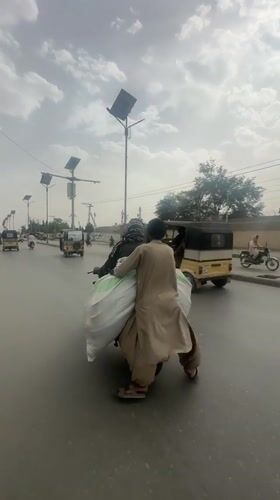 Daily life moments captured in Quetta: motorcycle riders, seated woman