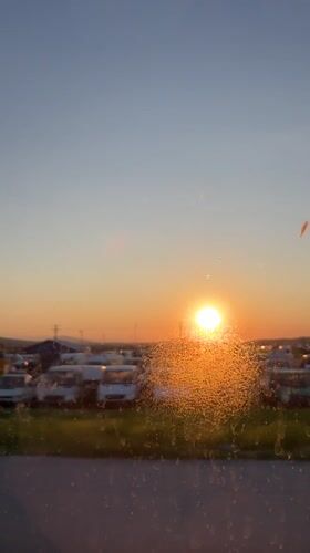 Sunset filmed through vehicle window in Haskovo, Bulgaria