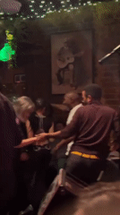 Late-night live music performance draws dancers to intimate Atlanta bar