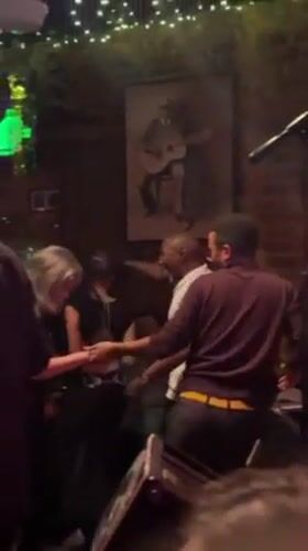 Late-night live music performance draws dancers to intimate Atlanta bar