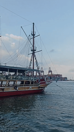 Tourist boats operate in Mersin harbor amid traditional dancing