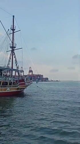 Tourist boats operate in Mersin harbor amid traditional dancing