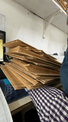 Person organizes paper bags on desk in Puebla, Mexico