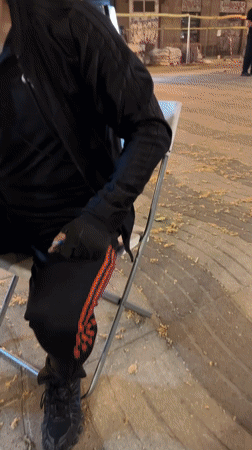 Street artist draws caricature in Barcelona plaza at night