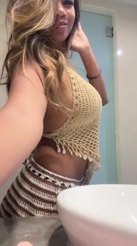Woman films bathroom dance routine in Kuta, Indonesia