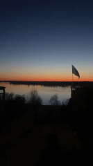 Sunset documented over water in Ольховка, Russia