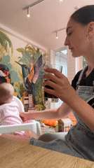 Mother and baby share meal at Sochi restaurant