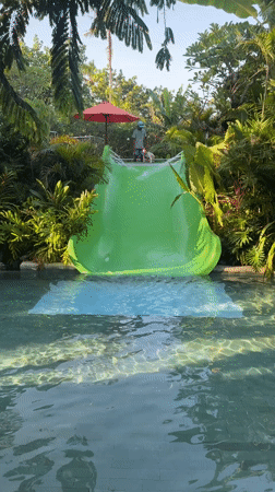 Children play at resort pool in Kuta, Indonesia