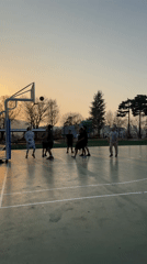 Men play sunset basketball in Daegu, South Korea