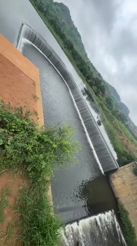 Swimming and exploring a scenic concrete weir in Dachino, Nigeria