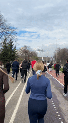 Morning runners gather on marked track in Moscow