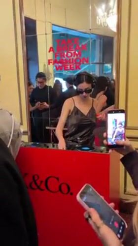 Female DJ performs morning set at Milano cafe