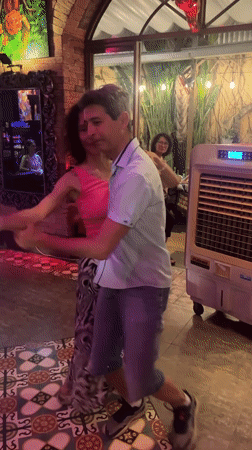 Couple dances at indoor party in Nha Trang