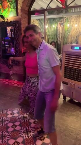 Couple dances at indoor party in Nha Trang