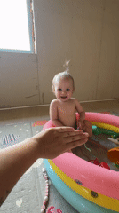 Mother documents morning playtime with baby in Russian village