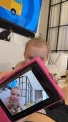 Baby photographed with pink camera in Krasnoyarsk