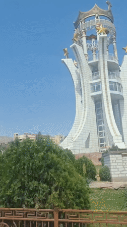 Clear day street scenes and monument documented in Khujand