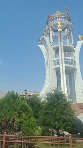 Clear day street scenes and monument documented in Khujand
