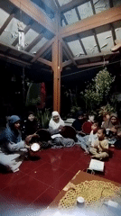 Informal gathering with music on a Ciomas patio