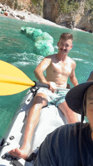 Kayakers conduct coastal cleanup near cliffs in Budva Montenegro