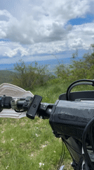 Motorcycle rider films rural landscape near Shipka, Bulgaria