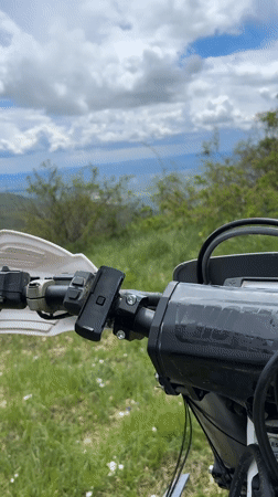 Motorcycle rider films rural landscape near Shipka, Bulgaria