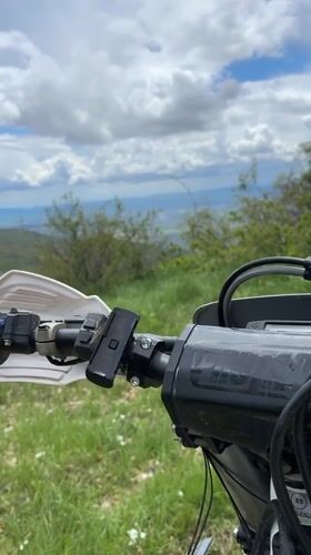 Motorcycle rider films rural landscape near Shipka, Bulgaria