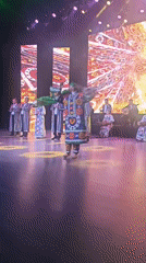 Traditional Tajik cultural event with live performances and formal ceremony