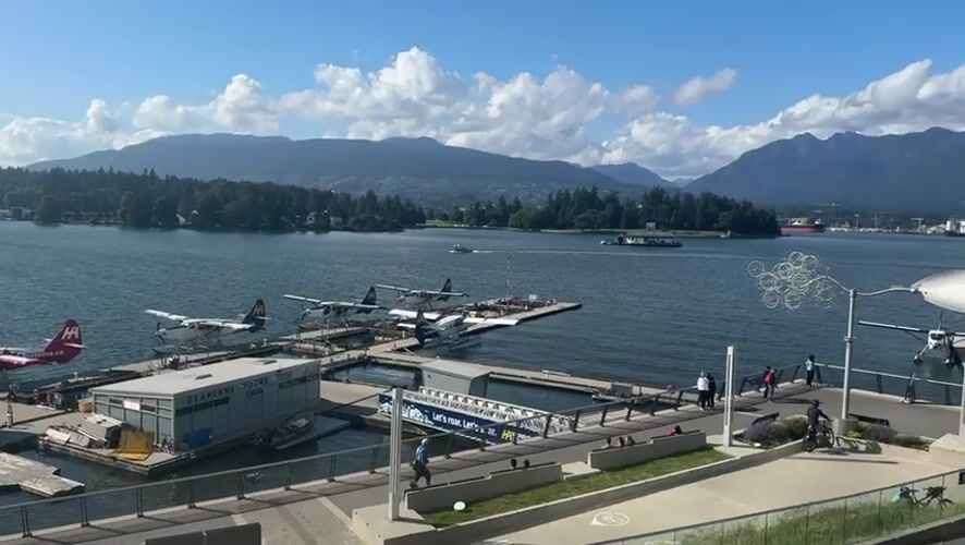 Vancouver waterfront landmarks documented during early morning tourist activity