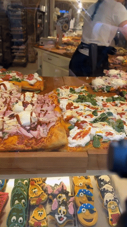 Tourist documents Bergamo's pizza shops and historic fountain
