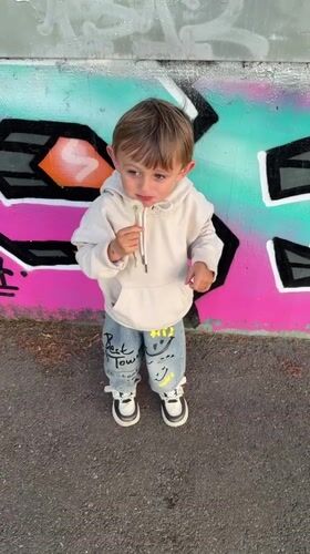 Child with dandelion spotted near fire truck in Riedlingen