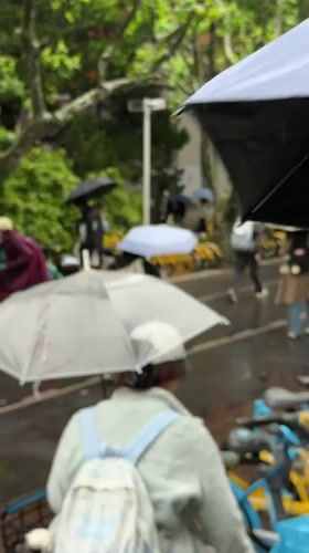 Rainy evening scenes captured across Shanghai intersections and indoor spaces