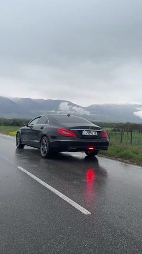 Mercedes parked on wet roadside in Bulgaria