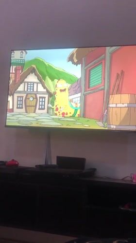 Animated cartoon with yellow creature viewed on TV in Enugu