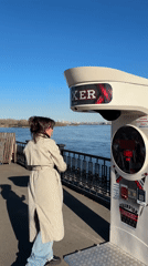 Woman poses on Vinogradovsky Bridge in Krasnoyarsk, Russia