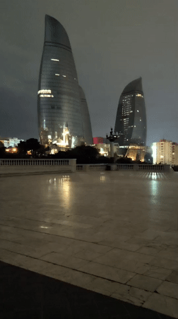 Night views captured of illuminated Baku cityscape from observation deck