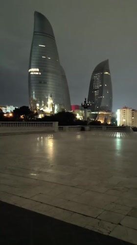 Night views captured of illuminated Baku cityscape from observation deck