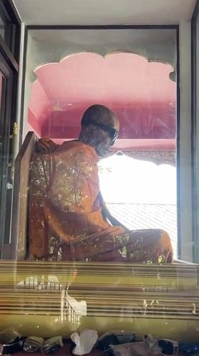 Mummified monk in robes and sunglasses, Ko Samui temple