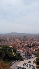 Panoramic Barcelona cityscape and recreational areas captured from hillside vantage