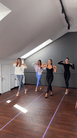 Four women practice in heels at Riga studio