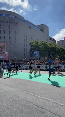 Marathon runners cross finish line in Barcelona street race