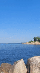 Nha Trang's northern shore: fishing boats, rocky breakwaters, bay views