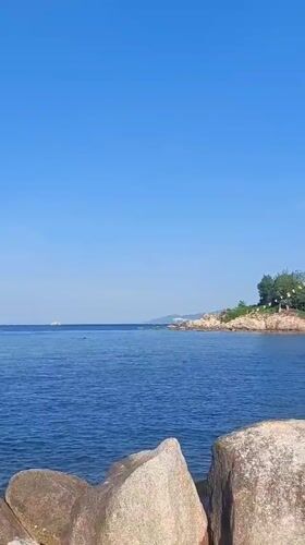 Nha Trang's northern shore: fishing boats, rocky breakwaters, bay views