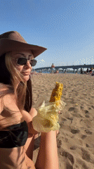Beach afternoon in Engels: corn, a bridge, and a passing helicopter.