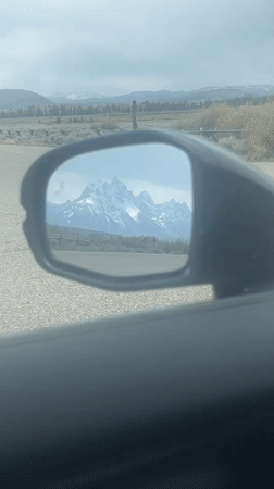 Driver captures Teton Range mountain views in car mirror