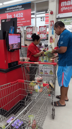 Late-night shopping continues at Patong Makro during rain shower