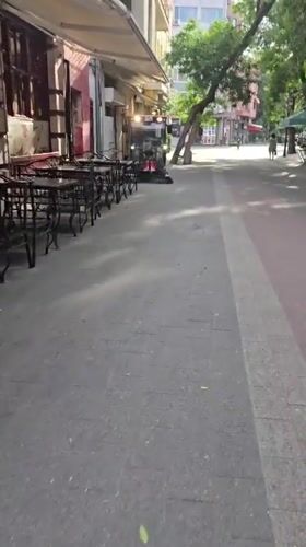 Early morning street cleaning and casual moments in Plovdiv