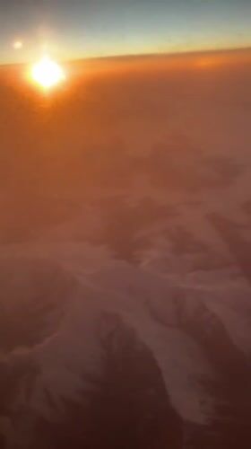 Airplane passenger captures sunset view over Georgia