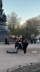 Fire dancers perform with flaming batons in Saint Petersburg park