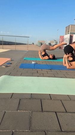 Outdoor yoga, street workouts, and morning coffee on a waterfront promenade